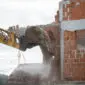 backhoe demolishing a brick house 2025 02 19 20 13 38 utc 85x85